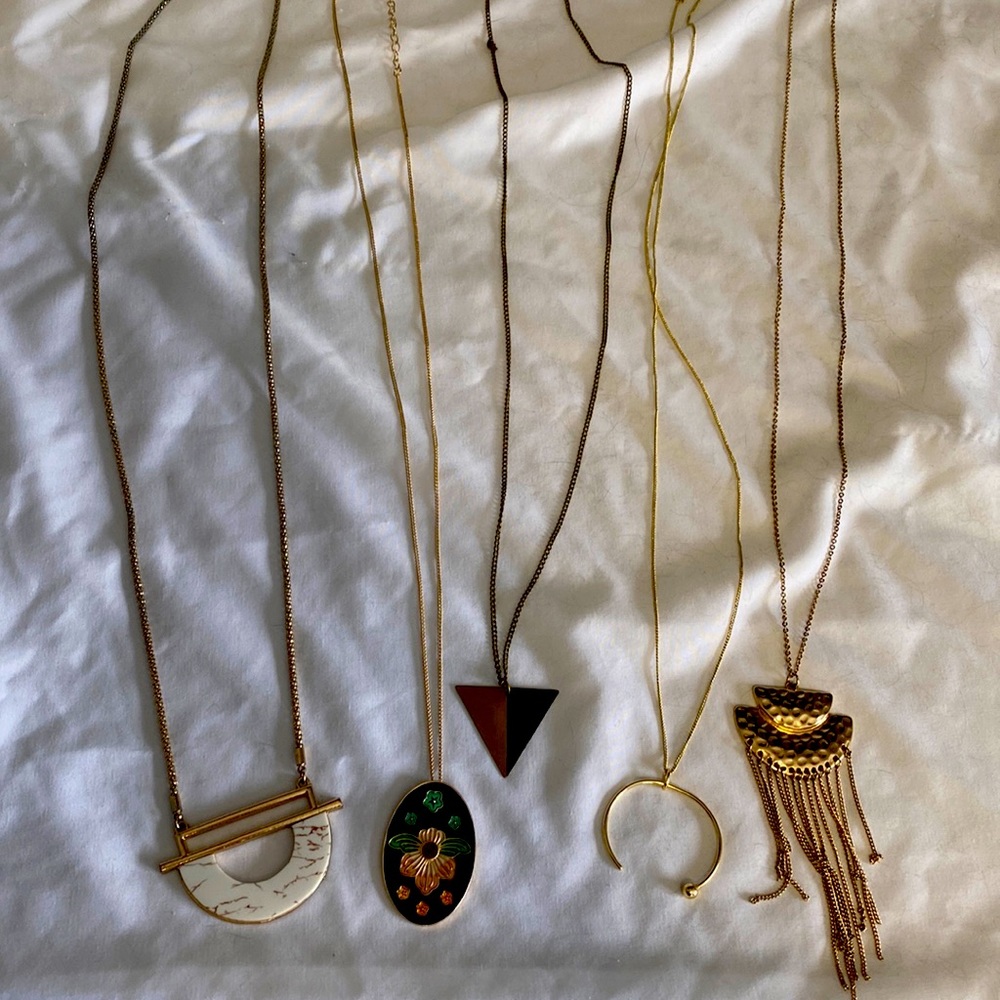 Five gold pendant style necklaces